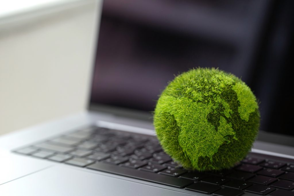 Technology,With,Nature,Concept.laptop,Keyboard,With,Green,Globe,On,It.