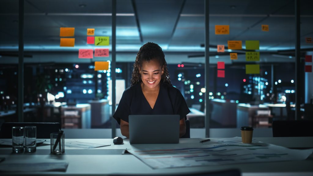 Portrait,Of,African,American,Businesswoman,Working,On,Laptop,Computer,In